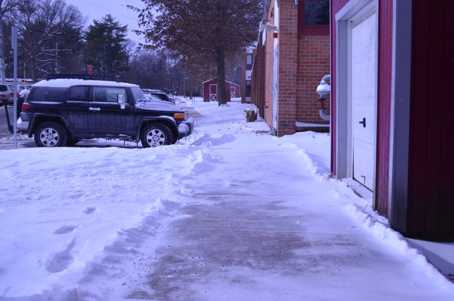 Icy sidewalks greeted students as they arrived at school. (Photo by James Carver)