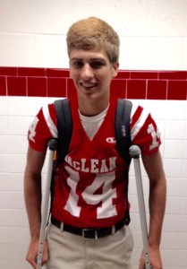 Senior Jonathan Pilsch wears his jersey and crutches to school before the game against Marshall on Sept. 11, 2015.