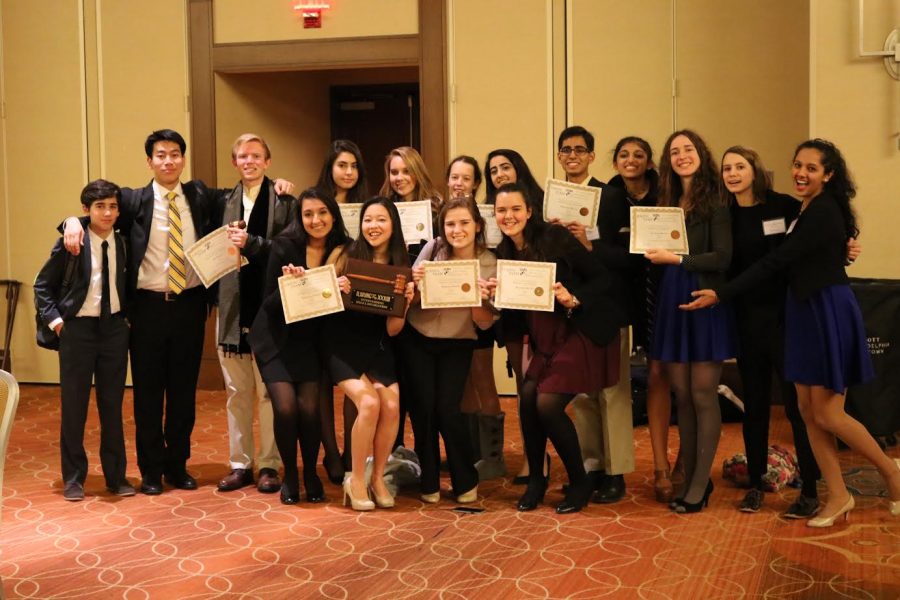 The 16 delegates who represented McLean MUN at the Ivy League Model United Nations Conference pose after the awards ceremony. (Photo courtesy of McLean MUN)