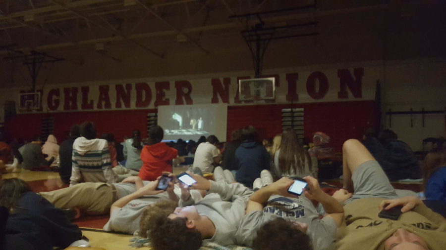 Students enjoy a night with friends watching a scary movie.
