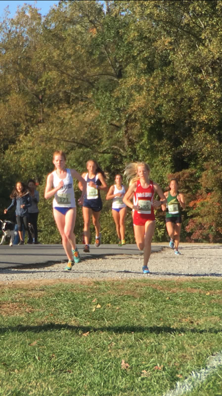 A race to the finish- Sophomore Natalie Flint strives to beat her opponents and place in the top 15 in her race. 
