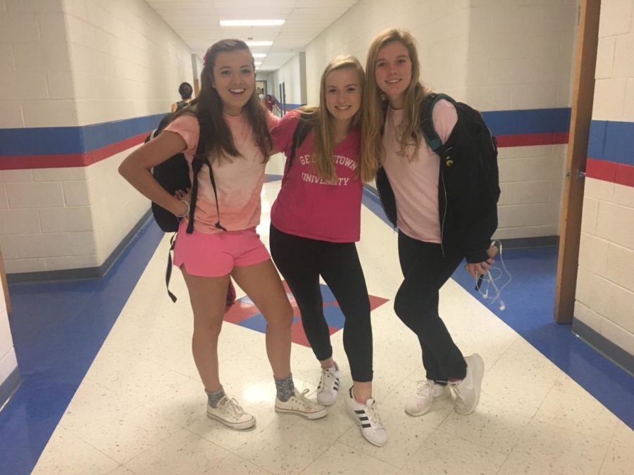 On Fridays, we wear pink-- Juniors Caroline Eldridge, Kathryn Burry, and Leah Horan pose during McLeans pink-out.