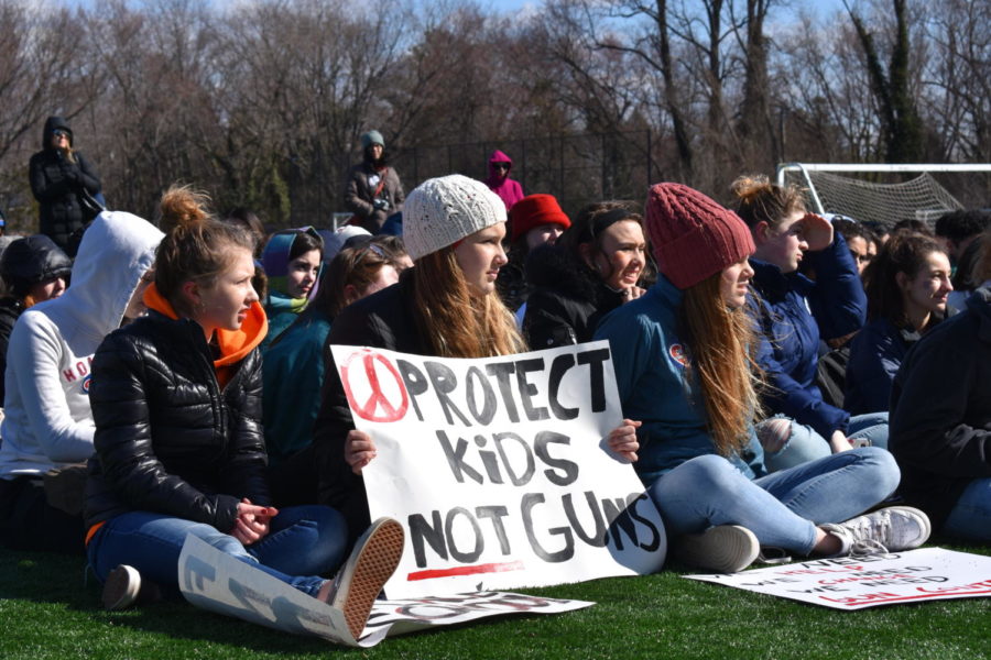Students sit together at Lewinsville Park at the walkout on March 14. Seven speakers attended the event, which lasted for about three hours. (photo by Maren Kranking)