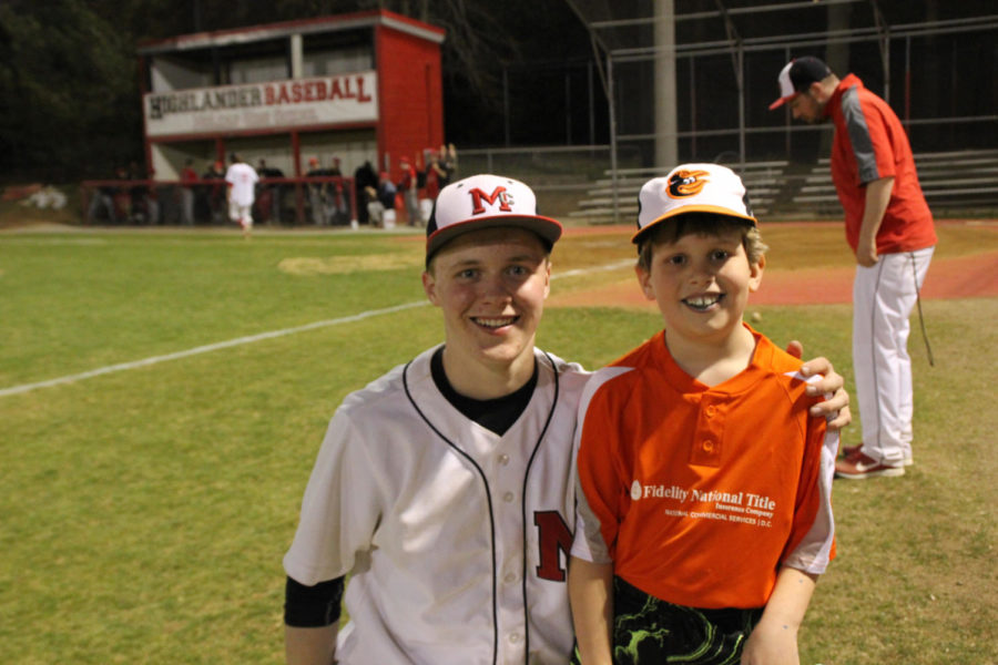 Owen Ricketts poses with Little Leaguer after a walk off hit. 
