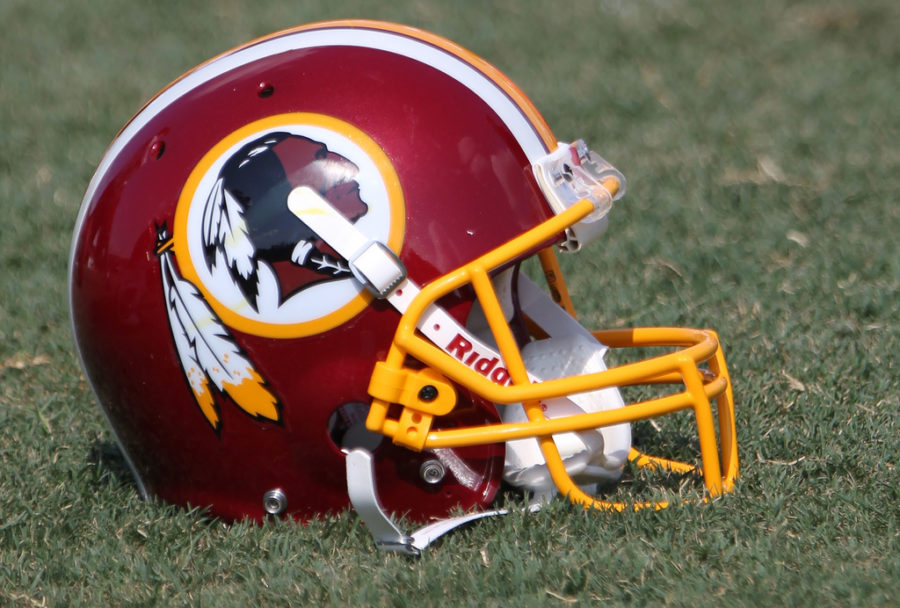 A Washington Redskins helmet resting on the field after training camp.
Photo obtained via Google Images with Creative Commons License