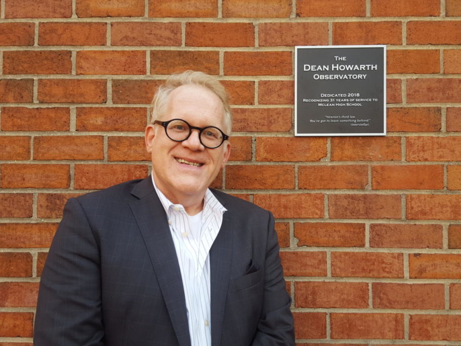 Physics teacher Dean Howarth smiles with the plaque dedicating the observatory in his name. This honor was given to Howarth as an acknowledgement of his 31-year career at McLean High School. (photo by Maren Kranking)