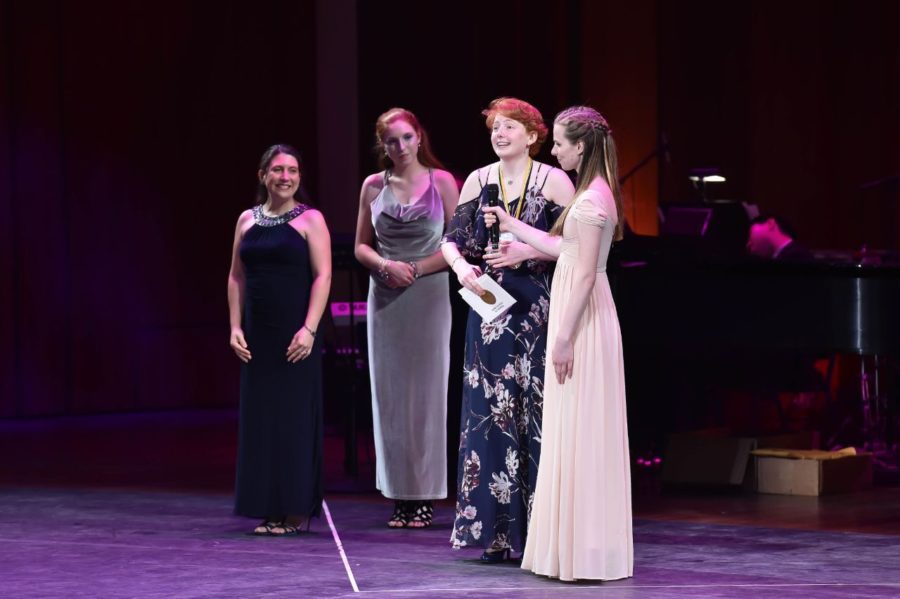 Abby Comey receiving award for best comedic actress, for her work in the musical 9-5.