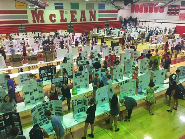 Board hoard - After interning at a range of locations for two weeks, over 200 seniors present their HIP projects on June 1 in the lower gym. (Photo courtesy of Greg Olcott)