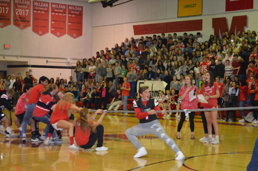 Senior Logan Johnson leads the student side of the student v. faculty game of tug-of-war