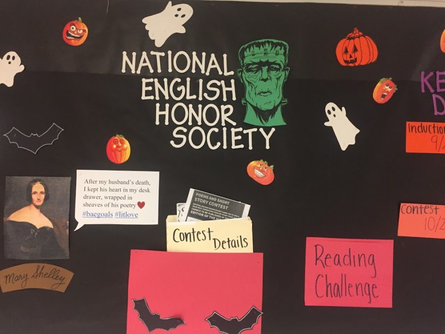 NEHSs bulletin board decorated at the last meeting for Halloween. It contains information about the club and upcoming events and is located in the blue hallway. (Photo by Stephanie McHugh)