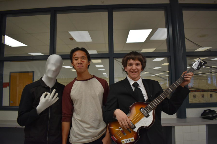 Seniors Bilvesh Akkupalli (left) and Aaron Fan (middle) pose with C lunch costume contest winner Alex Haldane, dressed as Paul McCartney.