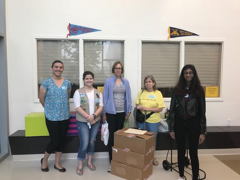 Emma Bradley and the group assisting her at Stanton stand in the elementary school with their many supplies. Bradley stands second to the left. (Photo courtesy of Emma Bradley)