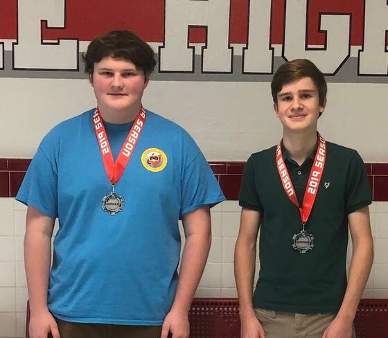 Seniors John Mutersbaugh (left) and Jules Le Menestrel (right) smile wearing their medals. The team stood out of more than 50 groups and received the best theme award in the BI II Hackathon.