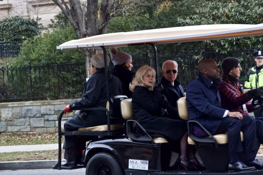 Funeral guests entering early in a shuttle cart