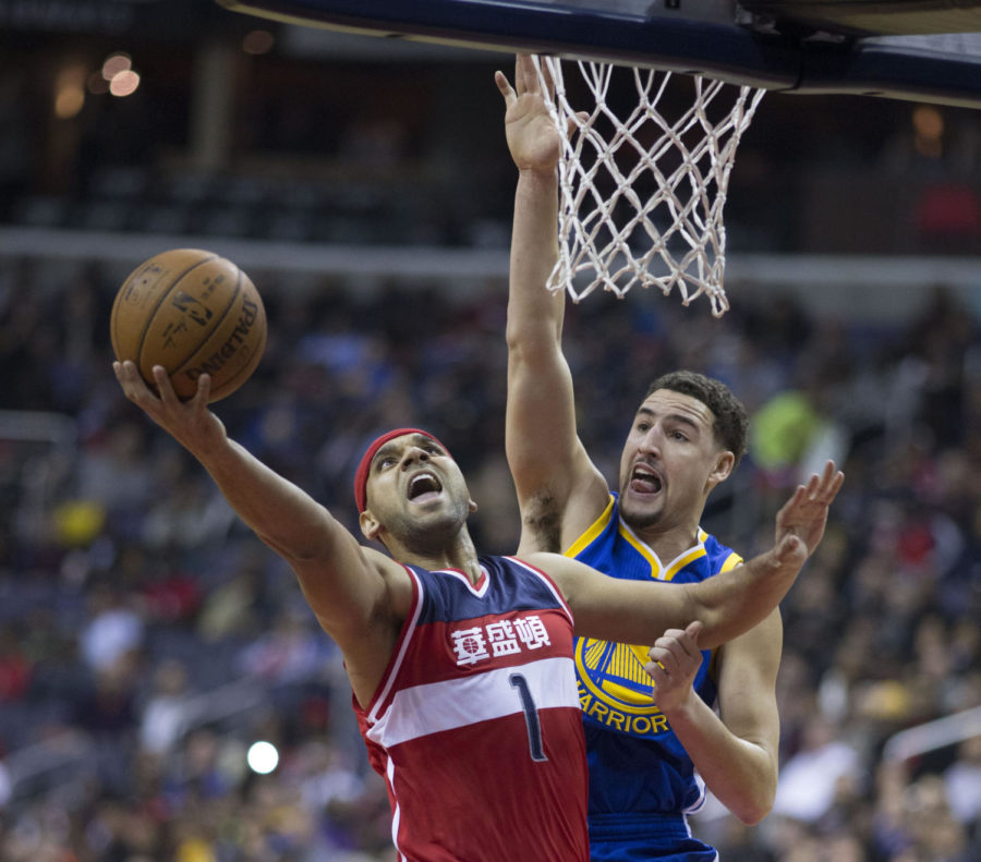 Warriors shooting guard Klay Thompson contests Jared Dudleys layup at a game on 2/3/2016 Photo obtained via KeithAllisonPhoto.com on Flickr under a Creative Commons license