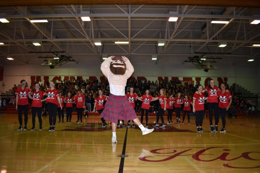 As the dance team performs for the pep rally mascot Angus joins in on the routine. 