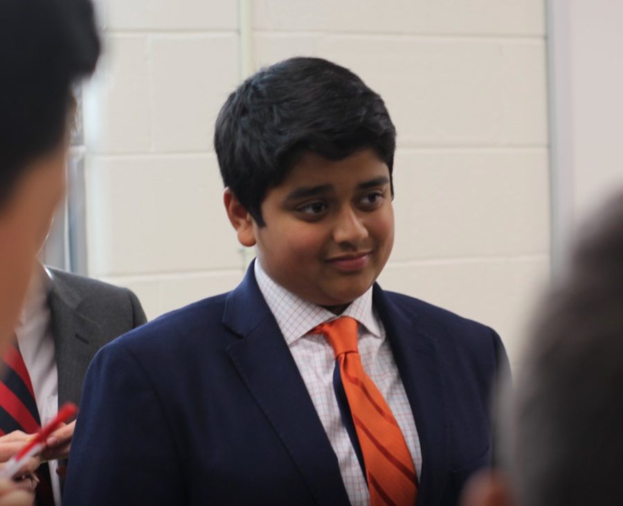 Abi Sastry smiles in anticipation at a fall mock conference for Model UN. His several hours of preparation gives him a confidence boost. 