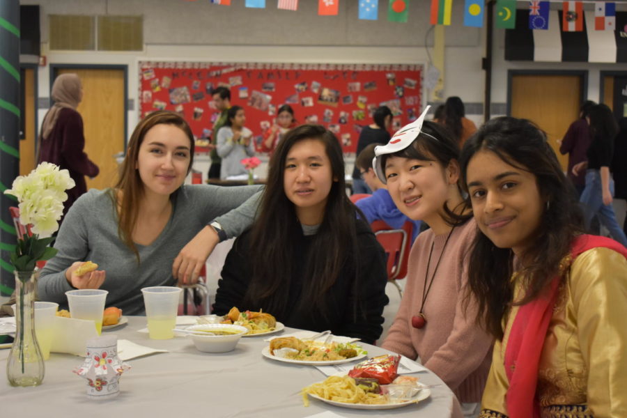 Students enjoy the abundance of food brought to International Night.