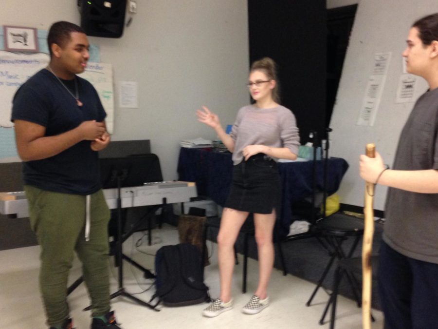 Practice Makes Perfect!
Students practice the opening of We Are The Champions by Queen. The group is led by Nicholas Barrett and the other two students are sophomore Hollie Stephanie Dawnball and senior Nicholas Thomas.  