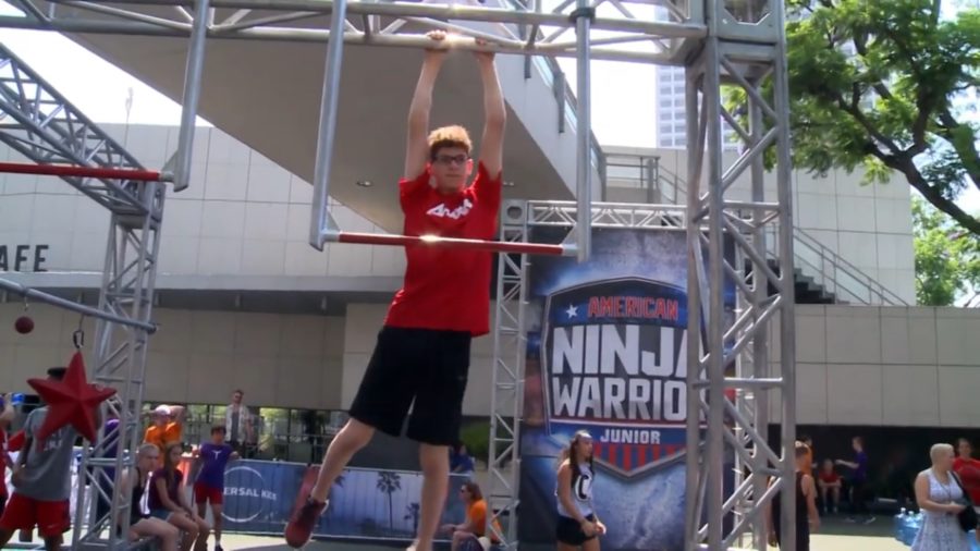 CLIMBING THROUGH THE COURSE —  Feinberg is going through his final course in Ninja Warrior Junior . He is on his way to $15,000 dollars. (Photo by Pete Feinberg) 