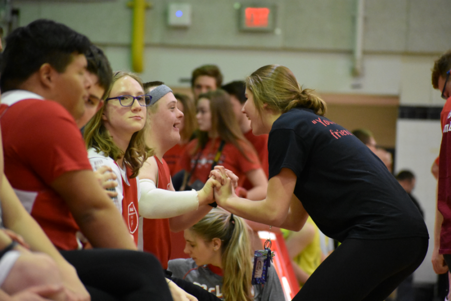 Junior Maggie Campion encourages Shue and the rest of the team during halftime. (photo by Maren Kranking)