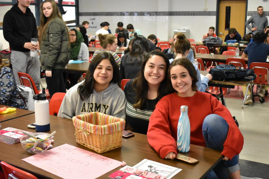 Sophomores Alisa Ahmad, Amy Verderame, and Samira Naeemi monitor raffle entries. Winners recieve a Chick-fil-a gift card or Mens Warehouse gift card.