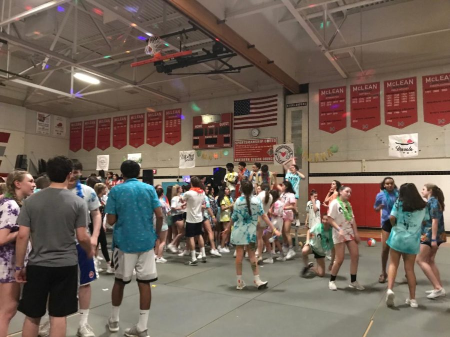 Leadership+students+and+their+peers+collect+on+the+McDance-a-thon+dance+floor+on+March+31.+The+dance+had+a+Hawaiian+theme.