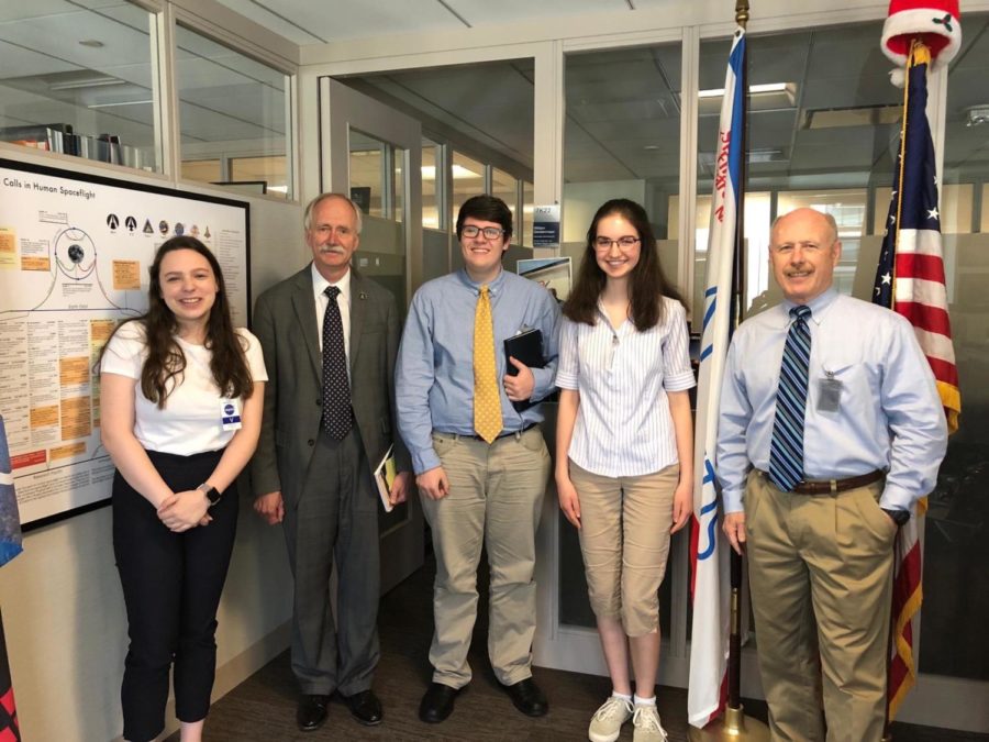 Sisk (Left) stands with William H. Gerstenmaier, two of her fellow interns, and a former astronaut known to her only as socks. (Picture courtesy of Maddie Sisk)