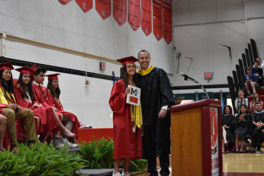 SGA council member Sarah Rice stands tall with a smile while accepting her Angus Award.   