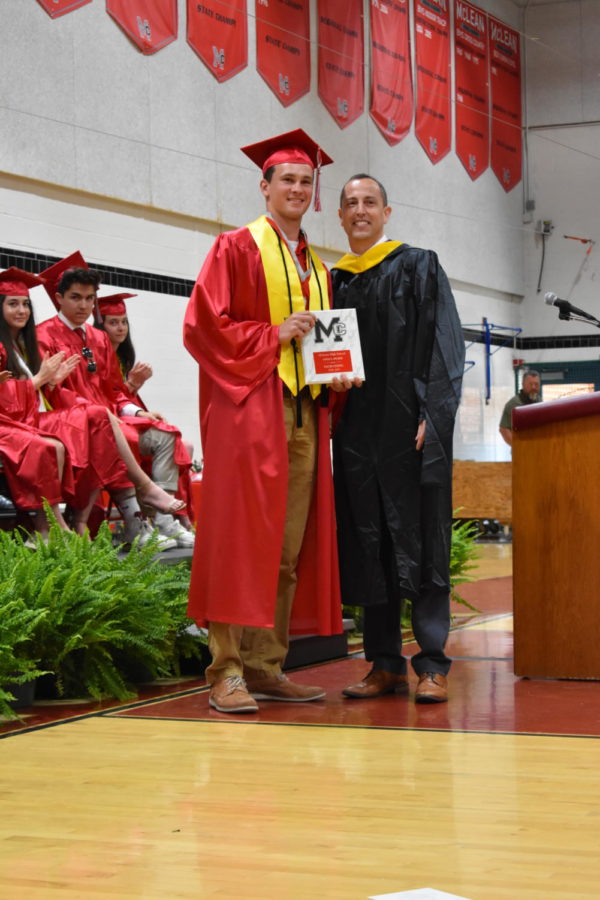 Student officer Aaron Hale receives schools Angus Award.  