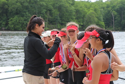 Coach Bianca Arrington congratulates the 2V girls on their 1st place win