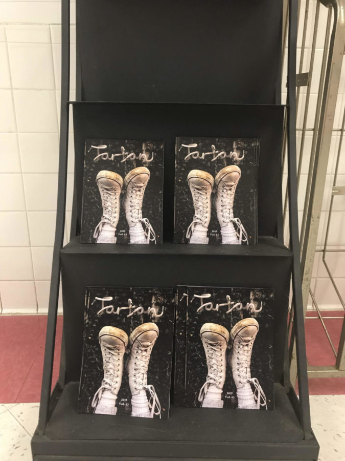 The new volumes of the Tartan Literary Magazine are neatly stacked on the stands next to room R133. The magazine was distributed on May 24, Friday.