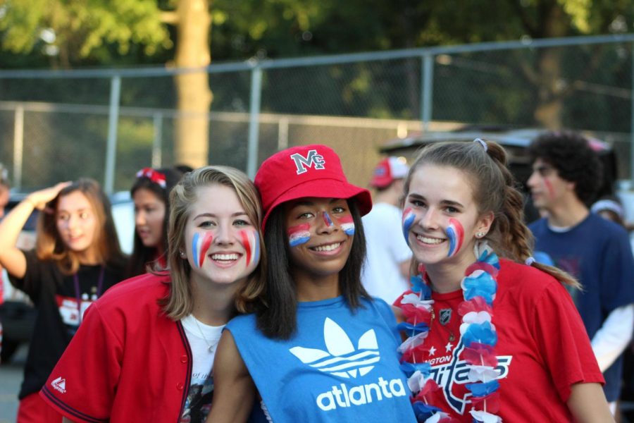 Students show their spirit at the tailgate. Maggie Campion, Amanda Moore, and Errin Ellington show off their USA gear.