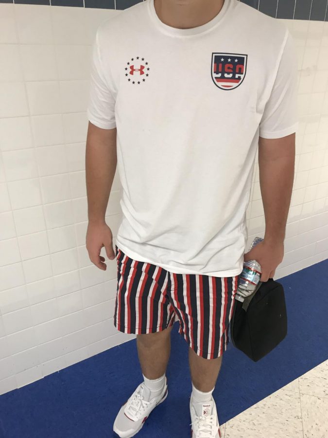 Junior Christian Carroll has a more discreet, yet thorough spirited look. Every article of clothing could be something an every day student might wear, but together, the red, white and blue makes Christian a walking American flag. (Photo by Zach Anderson)
