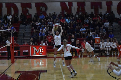 Sophomore Ella Park sets the ball over to the other side of the court.  McLean is putting up a fight against the Langley team. (Photo by Maya Amman)
