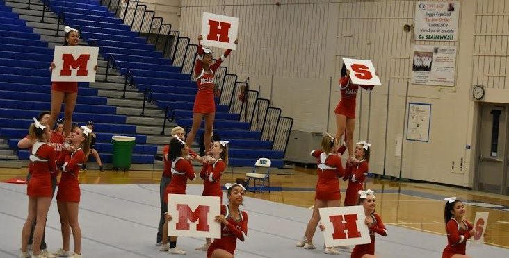 The cheer team represents McLean at their district competition. Photo by Isaac Lamoreaux.