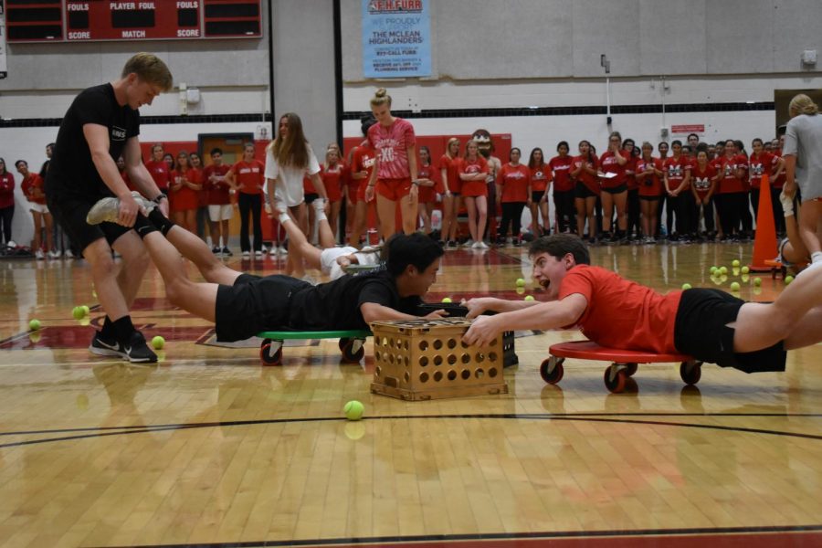 HUNGRY HIGHLANDERS- Highlanders compete in a series of different games. Junior Alex Lin and senior Paul Murray face off in the Hungry-Hungry Hippo game