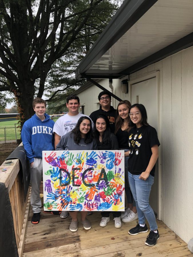 DEDICATED DECA - McLean DECA members join together for a picture as they celebrate the new leadership team being made. 