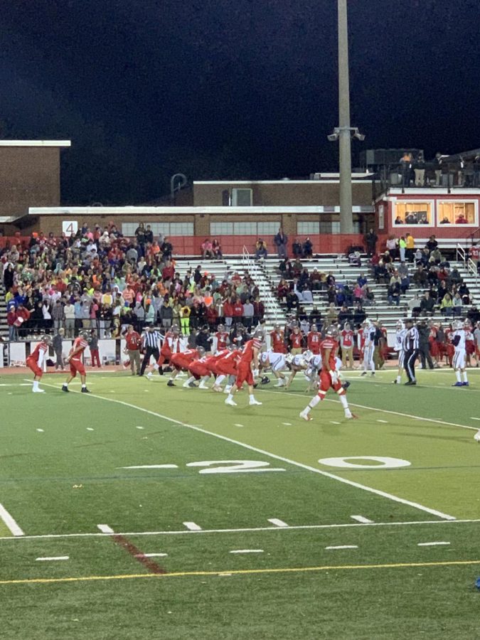 McLean varsity football team is on offense against Washington Liberty. It is the first quarter and the game is getting exciting.