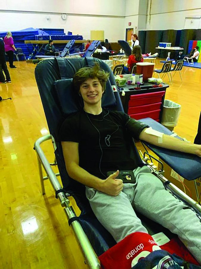 McLean+senior+John+Godwin+participates+in+the+blood+drive.+Student+body+president+could+not+help+but+to+donate+