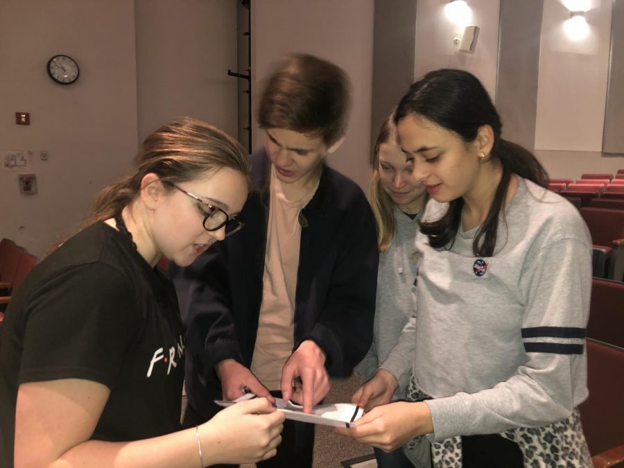Freshmen Sabrina Beadie, Sierra Balleisen, Anushka Parashar and Jack Abba look over the audition sides. As freshmen, they will not be able to audition, but still must observe the process carefully to prepare for the future. 