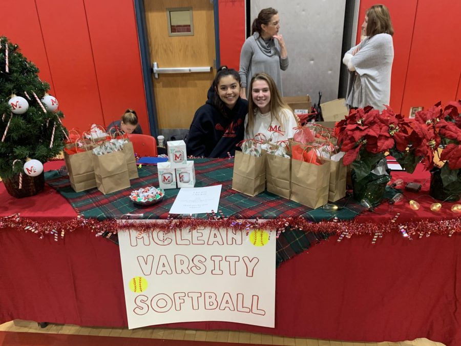 HOLIDAY HOME RUN —Girls varsity softball has spirit even in the off season. Along with selling beautiful gifts, they decorated their booths in celebration of the Christmas spirit.