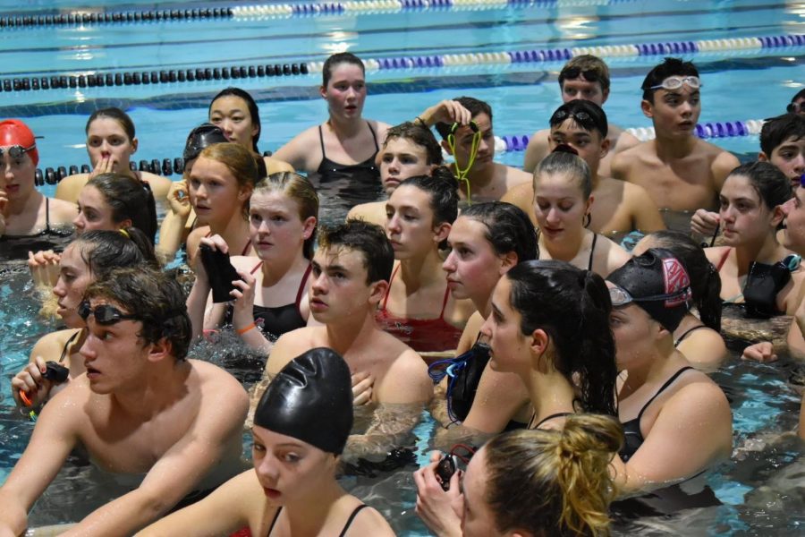 McLean swim huddles up for cheers before the start of the meet against W-L. They ended up winning this meet which occurred on Friday, Jan. 10.