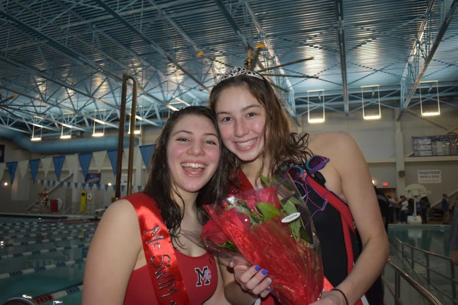 Senior Lauren Benedict and Kate Conklin are all smiles before the meet.