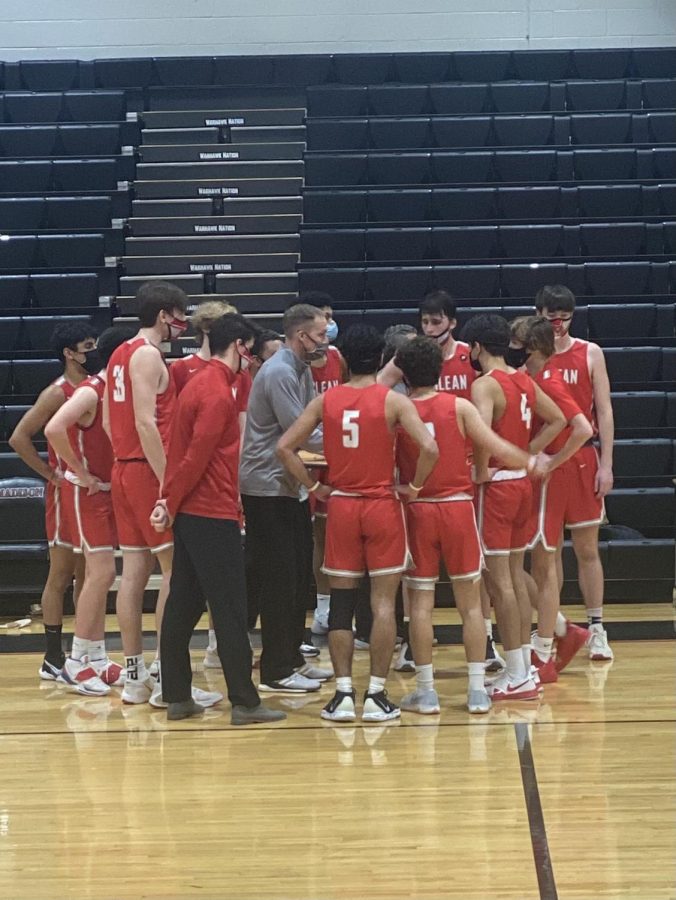 The team stands in a huddle during the game against Marshall in Regionals. McLean came on top with the win. (Photos provided by Zaiba Hasan)