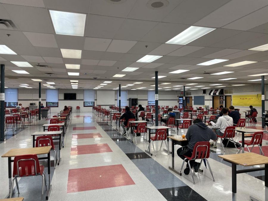 Student sit in the cafeteria during their lunch period. The uniform set up and strict social distancing may allow for better student safety, but minimize valuable social interaction. 