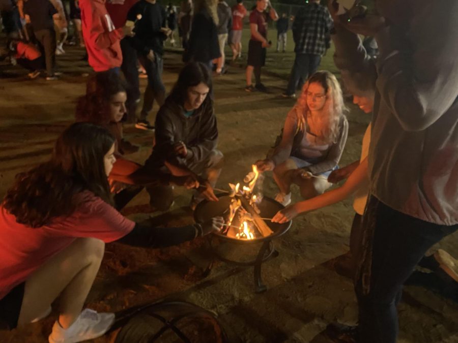 Students roast marshmallows at the beginning of the night.