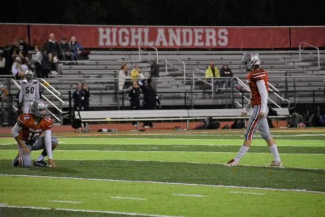 Kicker Tyler Fontenot and holder Matthew Speroni prepare for a field goal attempt. Fontenots prowess at the kicker position shone through against Washington-Liberty, as he converted multiple field goals.