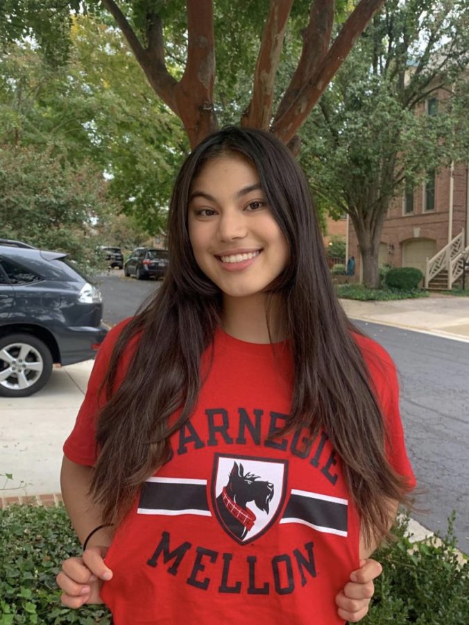 McFarland poses with the logo of Carnegie-Mellon University. She will be joining the Tartans 2026 class as a middle blocker.