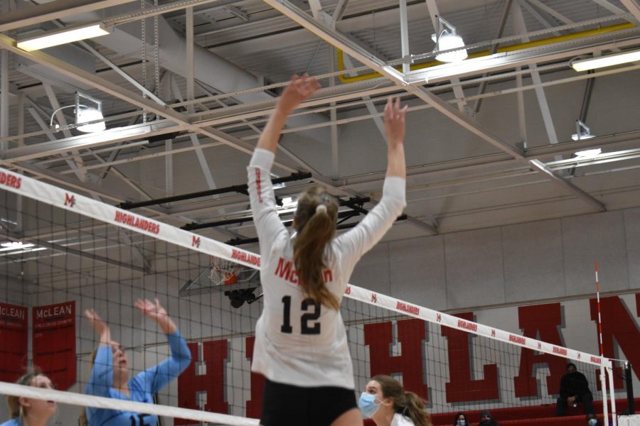 Rising up to Success—Senior Nicole Mallus gets ready to spike the ball after a set from her teammate. 